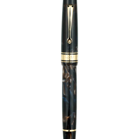 Omas Bologna Galassia gold trim fountain pen with sleek black body and elegant gold accents, close-up view.