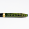 Wahl-Eversharp Decoband green ebonite fountain pen with chased design and gold trim, showcasing its elegant craftsmanship.