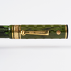 Wahl-Eversharp Decoband green ebonite chased fountain pen with gold trim, showcasing elegant craftsmanship and detailed design.