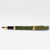 Wahl-Eversharp Decoband green ebonite chased fountain pen with gold trim, showcasing elegant craftsmanship and intricate design.