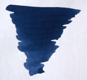 Diamine denim-colored bottled fountain pen ink in a glass bottle with a label, ideal for writing and calligraphy.