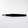 Cathay Monolith Tamenuri fountain pen with a glossy Tamenuri finish, featuring a sleek design and metal accents.