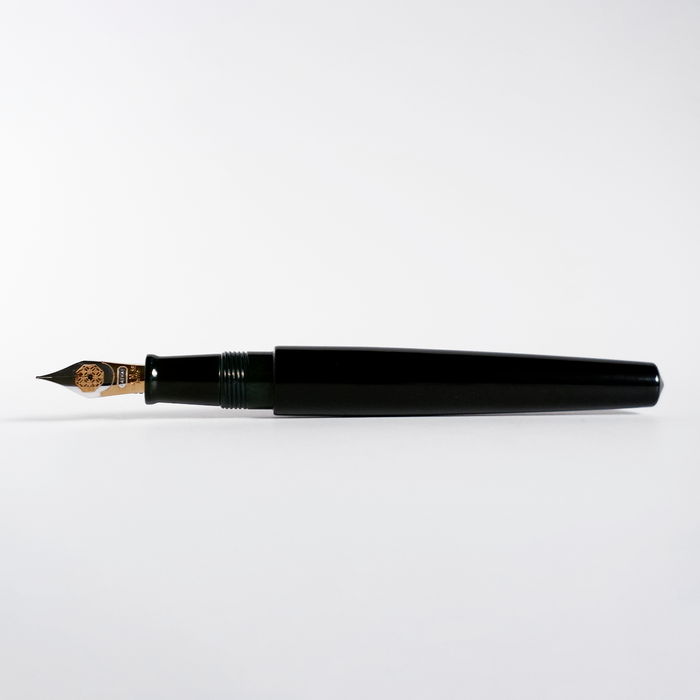Cathay Monolith Tamenuri fountain pen with a glossy Tamenuri finish, featuring a sleek design and metal accents.