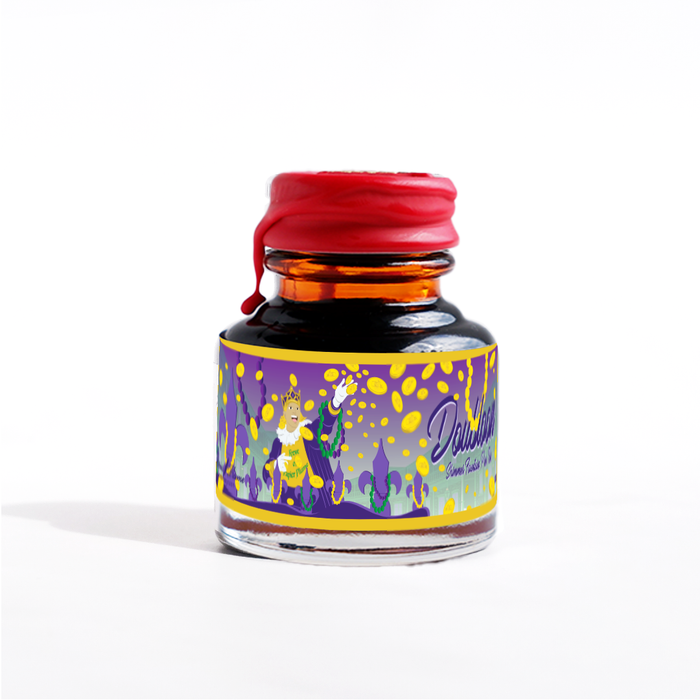 Papier Plume Doubloon shimmer fountain pen ink bottle with gold and blue ink swirls, showcasing luxurious ink for writing and calligraphy.