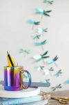 Assembli Paper Dragonfly Collection craft set featuring green and mango-colored paper dragonflies on a craft display.