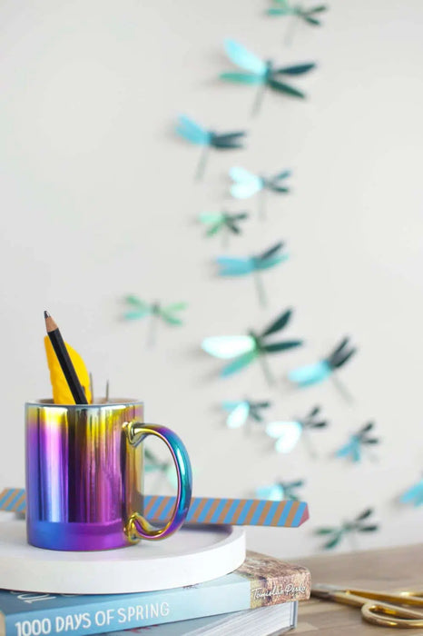 Assembli Paper Dragonfly Collection craft set featuring green and mango-colored paper dragonflies on a craft display.