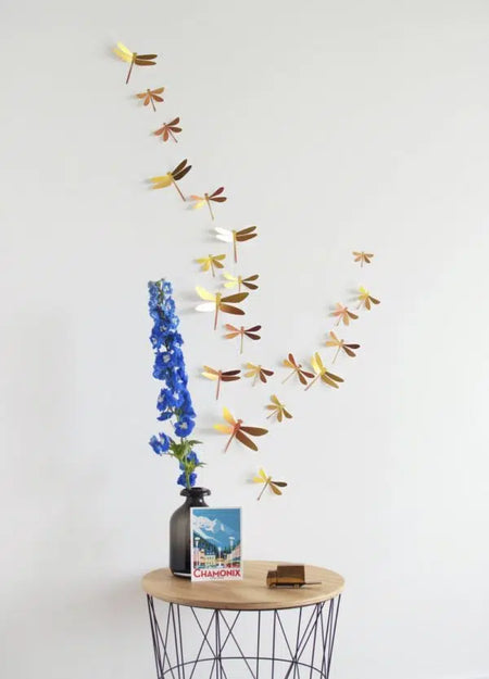 Assembli Paper Dragonfly Collection craft with yellow sunset-colored paper dragonflies for creative decorating projects.