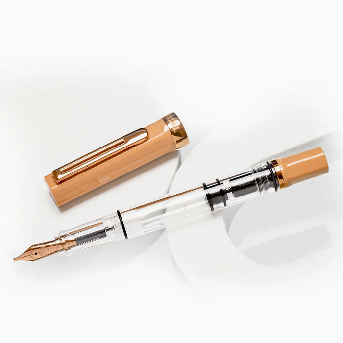 Twsbi Eco Caffè Bronze fountain pen with a sleek bronze finish, showcasing its elegant design and smooth ink flow.