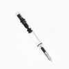 Twsbi Eco-T Clear fountain pen with transparent body and silver accents, showcasing the nib and ink chamber.