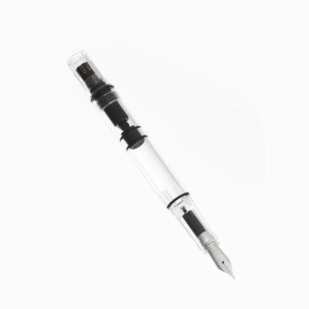 Twsbi Eco-T Clear fountain pen with transparent body and silver accents, showcasing the nib and ink chamber.