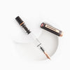 Twsbi Eco fountain pen in smoke Rose Gold with a sleek body and silver accents, displayed on a white background.