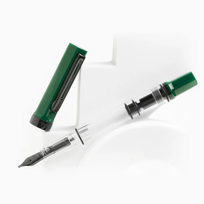 Twsbi Eco Irish Green fountain pen with black onyx accents, featuring a sleek green body and metal clip for writing elegance