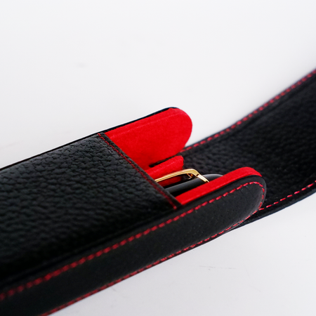Black leather pen case by Eng Leather Co. with two compartments for storing and protecting pens.