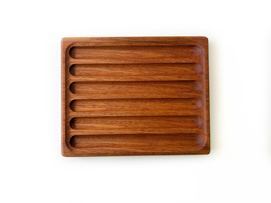 Eng Leather Co. wooden pen tray with compartments for organizing pens and stationery, made of polished wood and leather accents.