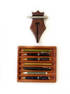 Mahogany wooden pen rest by Eng Leather Co. featuring a sleek design to hold and protect writing pens.