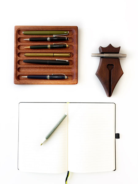 Eng Leather Co. wooden pen rest with mahogany finish, designed to hold and organize pens on a desk.