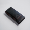 Black leather pen case by Eng Leather Co. with three compartments, designed for stylish and organized pen storage.