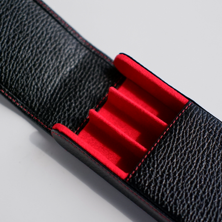 Black leather pen case by Eng Leather Co. with three compartments, designed for stylish, organized storage of writing instruments.
