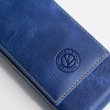 Blue leather pen case by Eng Leather Co. with three compartments, designed for storing and protecting pens.