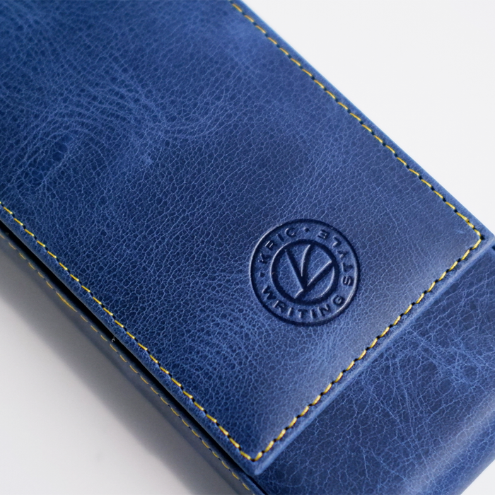 Blue leather pen case by Eng Leather Co. with three compartments, designed for storing and protecting pens.