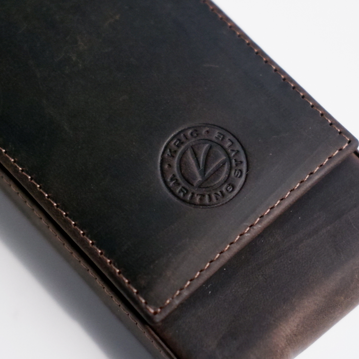 Dark brown leather pen case by Eng Leather Co. with three slots, designed for stylish storage and organization of pens.