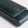 Green leather pen case by Eng Leather Co. with a 3-pen capacity, featuring a sleek, durable design for stylish organization.