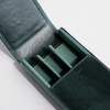 Green leather pen case by Eng Leather Co. with three compartments, designed to securely hold and organize pens.