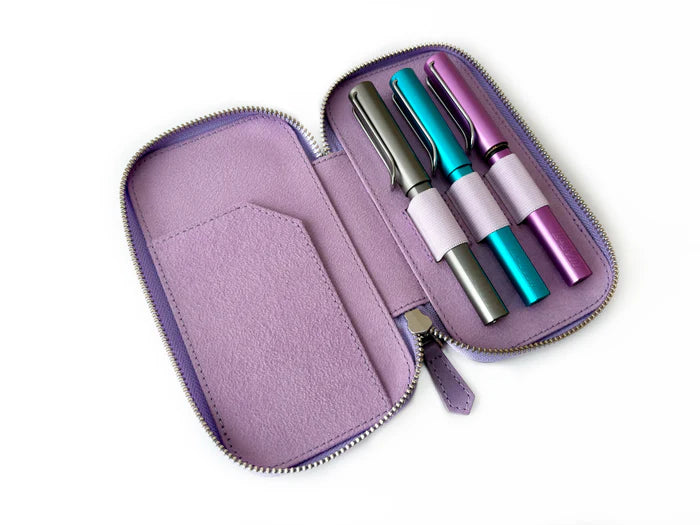 Light lavender leather pen case by Eng Leather Co. with three slots for pens, showcasing smooth textured leather and stitching.
