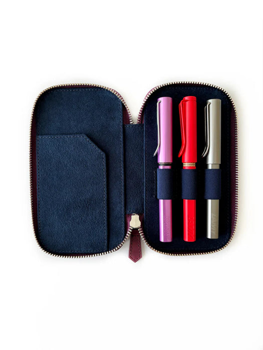 Eng Leather Co. burgundy leather 3-slot pen case with soft texture, designed for organizing and protecting writing instruments.