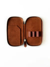 Eng Leather Co. 3-slot leather pen case in rich toffee color, showcasing its smooth leather texture and compact design.