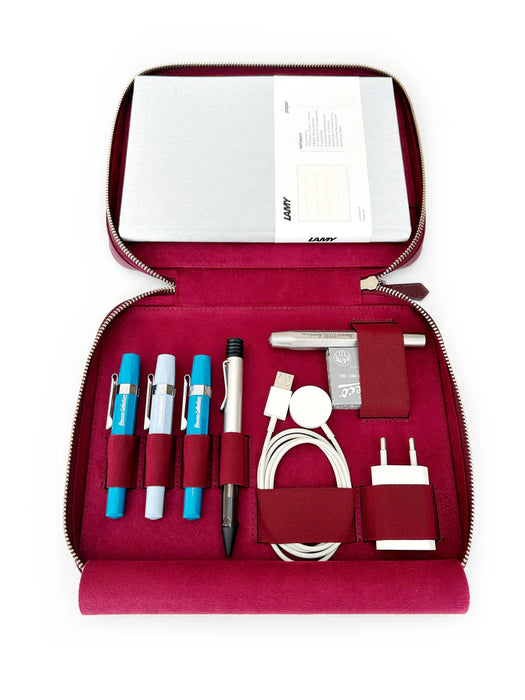Dark black violet leather pen case with four slots from Eng Leather Co. designed for A5-sized organizers.