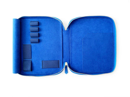 Eng Leather Co. Prussian Blue leather pen case with four slots for A5-sized pens and accessories.