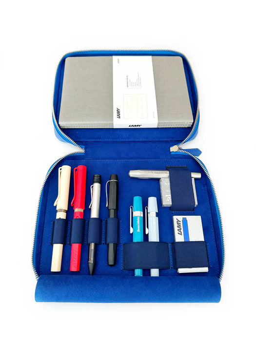 Eng Leather Co. Prussian Blue leather pen case with four slots for A5-sized pens and accessories.