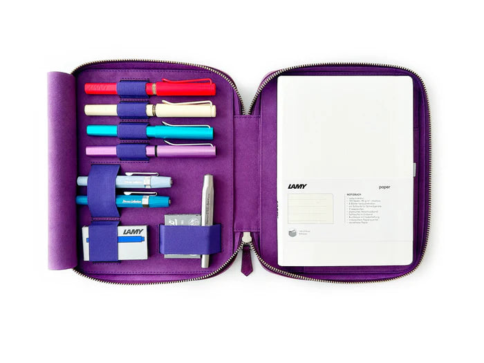 Violet leather pen case with four slots from Eng Leather Co., designed to hold A5-sized pens and writing accessories.