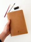 Vegan Apple leather A5 journal cover by Eng Leather Co. with sleek design and secure closure, perfect for protecting notebooks.