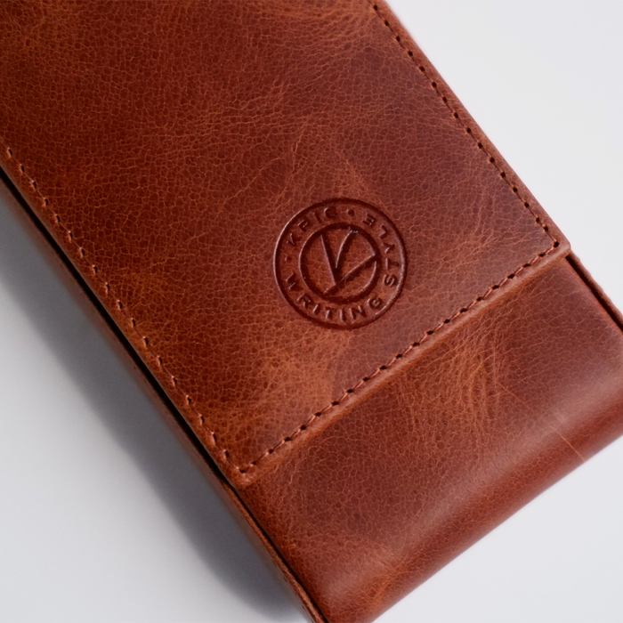 Light brown leather pen case by Eng Leather Co. with a 3-pen capacity, featuring a sleek, durable design for everyday use.