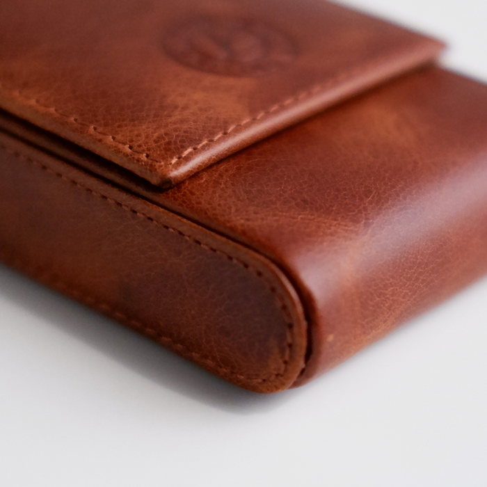 Light brown Eng Leather Co. 3-pen hard case with durable leather exterior and secure closure, designed for stylish pen storage.