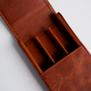 Light brown leather pen case by Eng Leather Co. with a 3-pen capacity, featuring a sleek, durable design and secure closure.