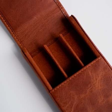 Light brown leather pen case by Eng Leather Co. with a 3-pen capacity, featuring a sleek, durable design and secure closure.