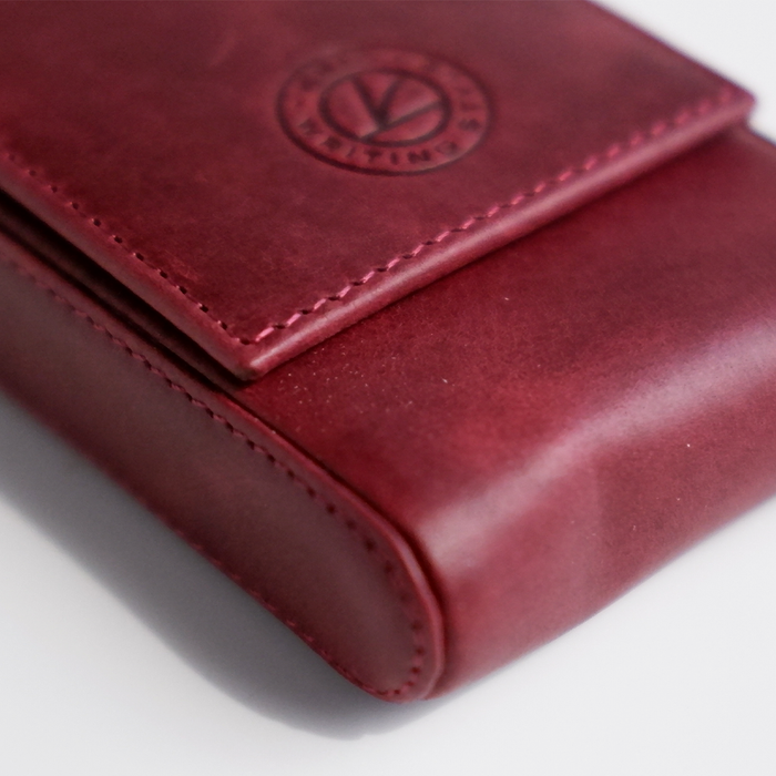 Red leather pen case by Eng Leather Co. with 3 compartments for storing pens and writing instruments.