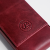 Red leather pen case by Eng Leather Co. with 3 compartments, designed to hold and protect writing instruments.