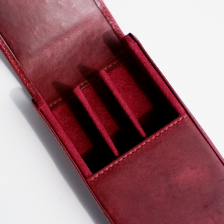 Red leather pen case by Eng Leather Co. with a 3-pen capacity, featuring a sleek, durable design for stylish storage.