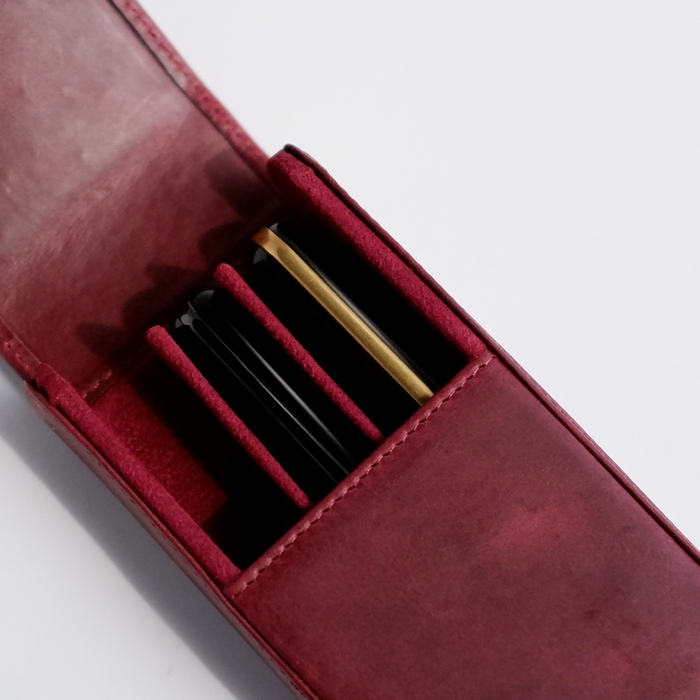 Red leather pen case by Eng Leather Co. with a 3-pen capacity, showcasing a sleek, durable design for stylish writing accessories.