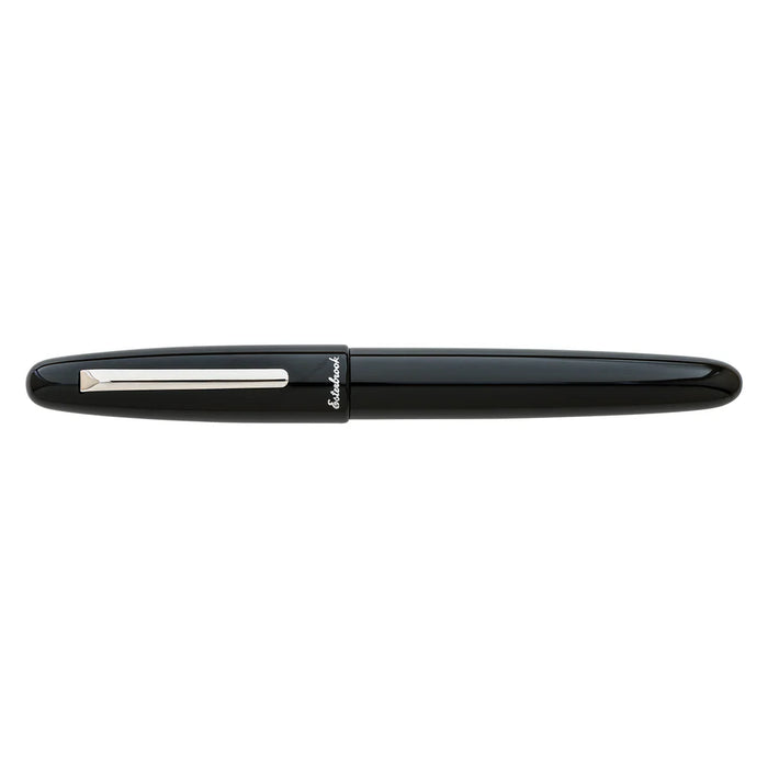 Esterbrook Estie fountain pen with silver fittings, black body, and closed cap, showcasing elegant writing instrument design