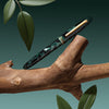 Esterbrook Estie Evergreen fountain pen ink bottle with the deep green ink visible, showcasing the premium ink packaging.