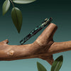 Esterbrook Niblet Evergreen fountain pen ink bottle with green ink visible, designed for use with fountain pens.