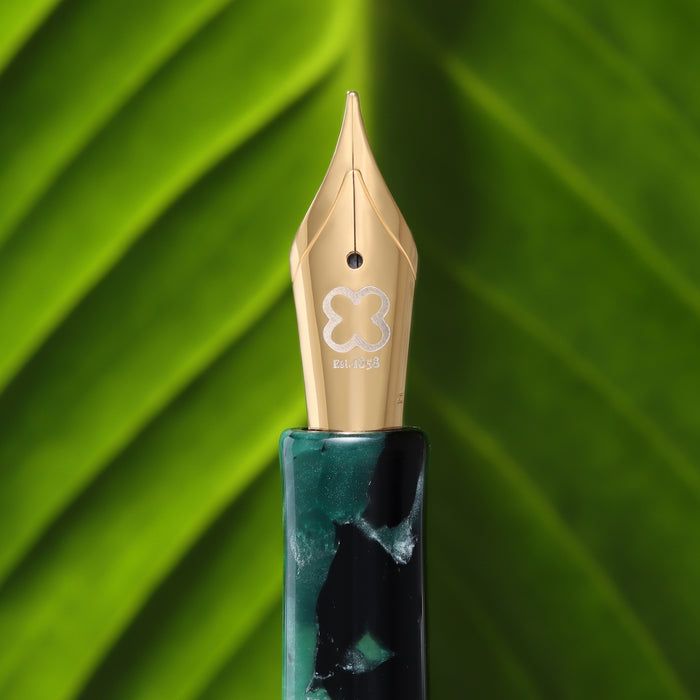 Esterbrook Niblet Evergreen fountain pen ink bottle with green ink visible in the glass container.