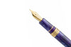 Esterbrook The Rockstar Estie fountain pen with a sleek black body and gold accents, showcasing its elegant design and fine nib.