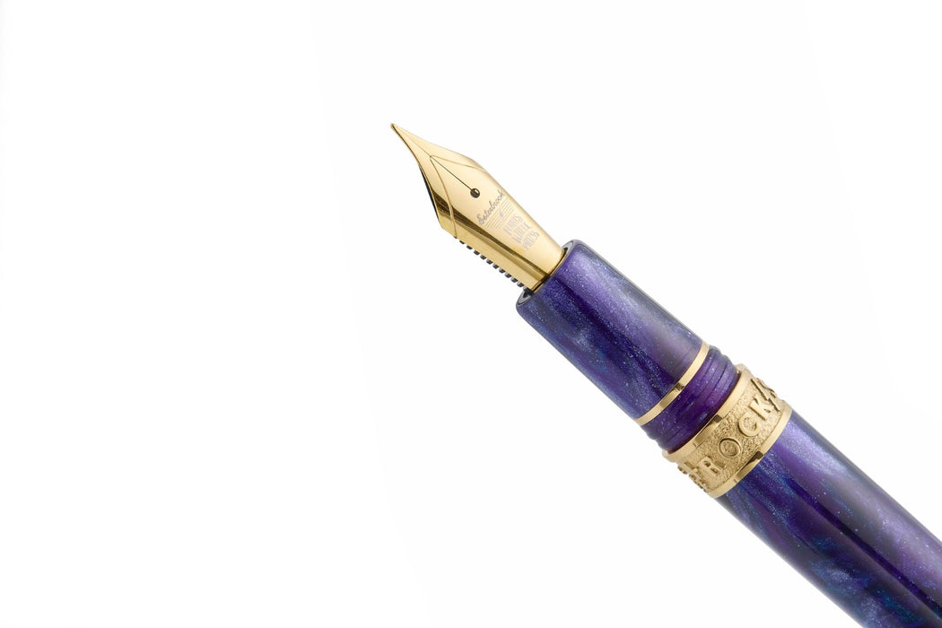Esterbrook The Rockstar Estie fountain pen with a sleek black body and gold accents, showcasing its elegant design and fine nib.