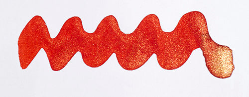 Diamine Shimmertastic Firefly fountain pen ink with shimmering, vibrant orange and gold accents in a glass ink bottle.